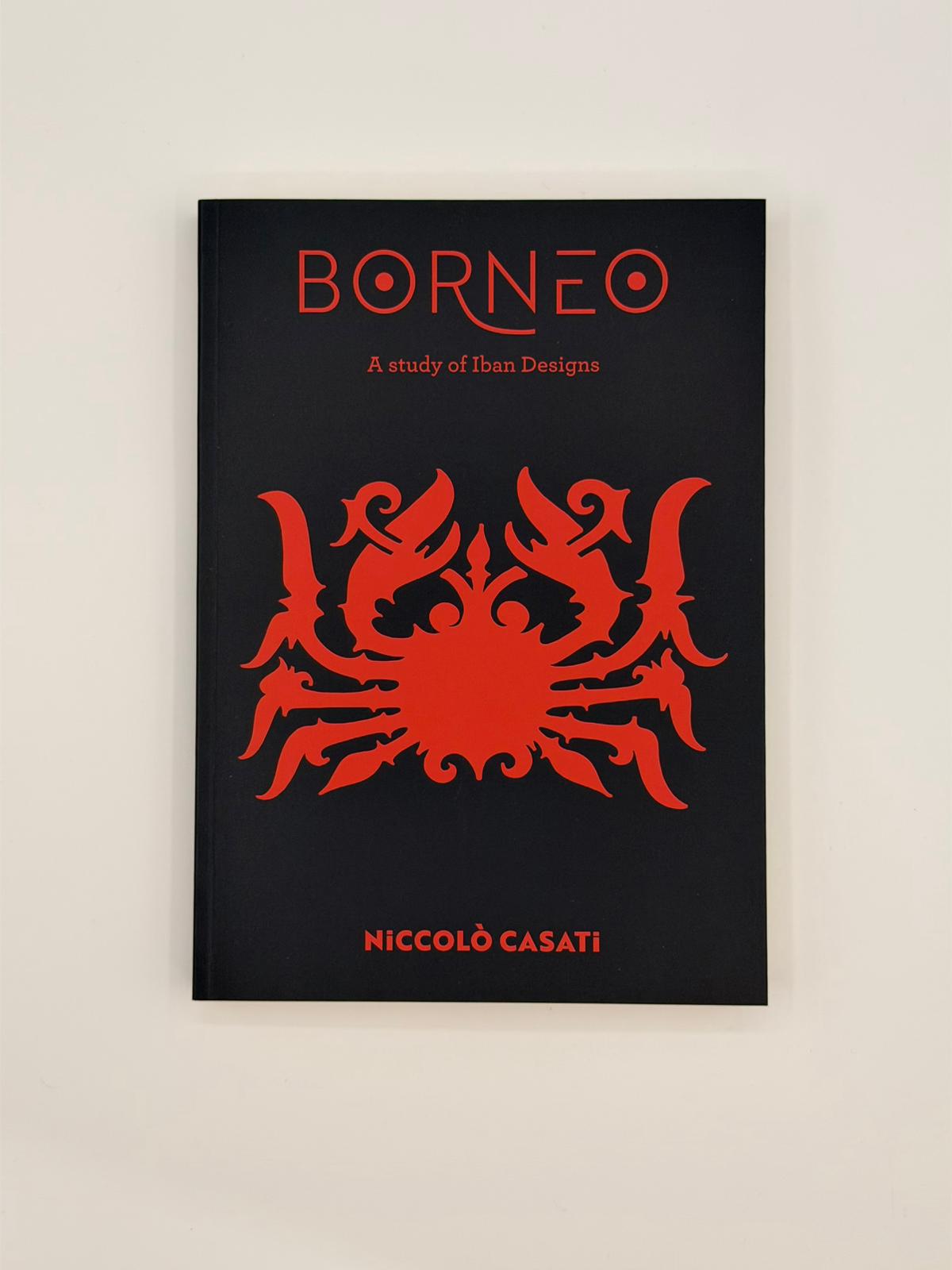 Book cover of 'Borneo: A study of Iban Designs' by Niccoló Casati with a red design on a black background.